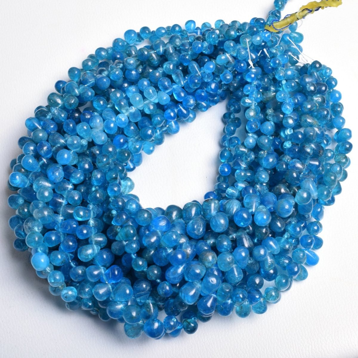 Natural Neon Blue Apatite Smooth Teardrop Beads (4) Natural Neon Blue Apatite Smooth Teardrop Beads